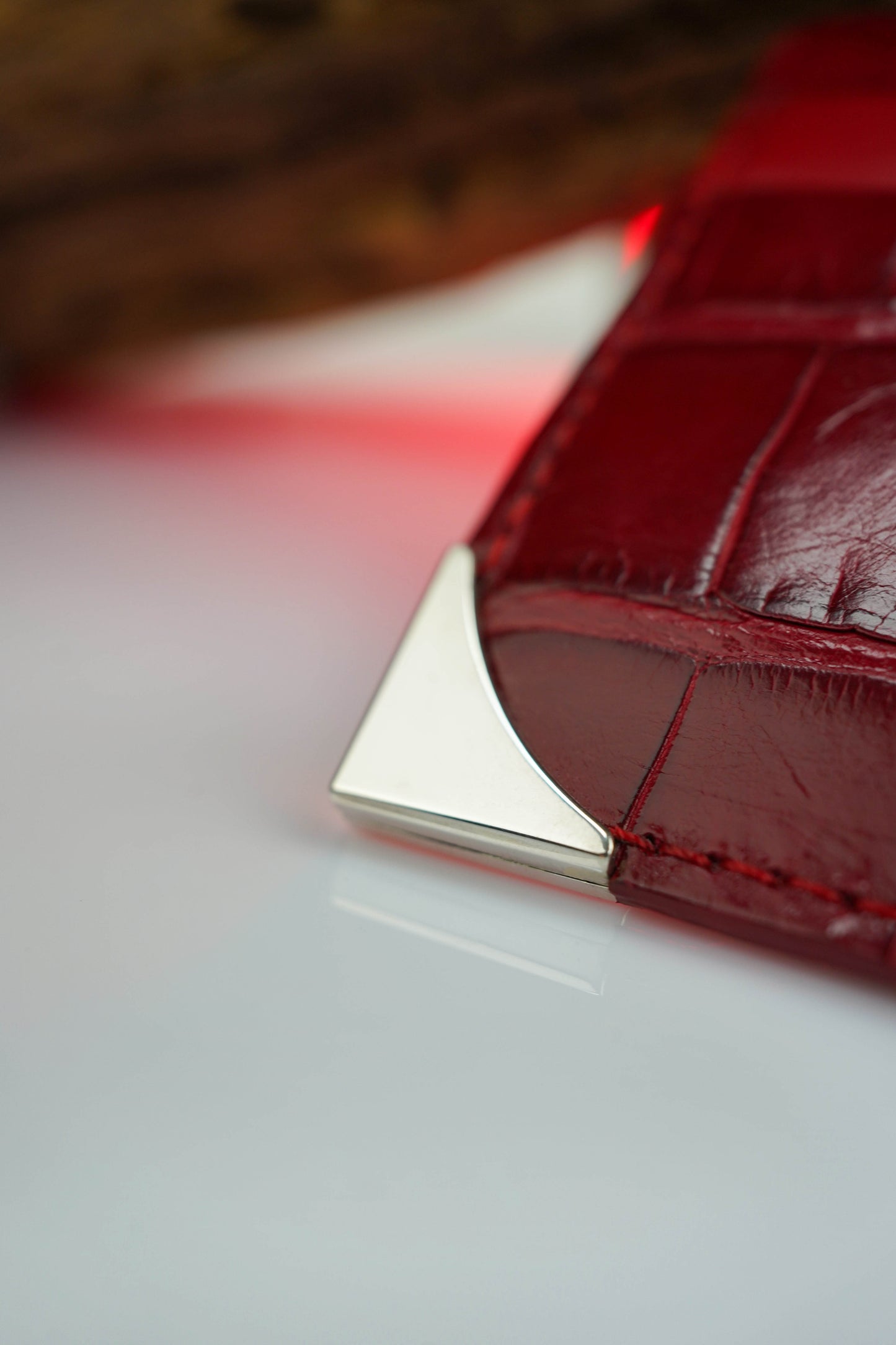 Cardholder made of crocodile leather with corners made of natural silver